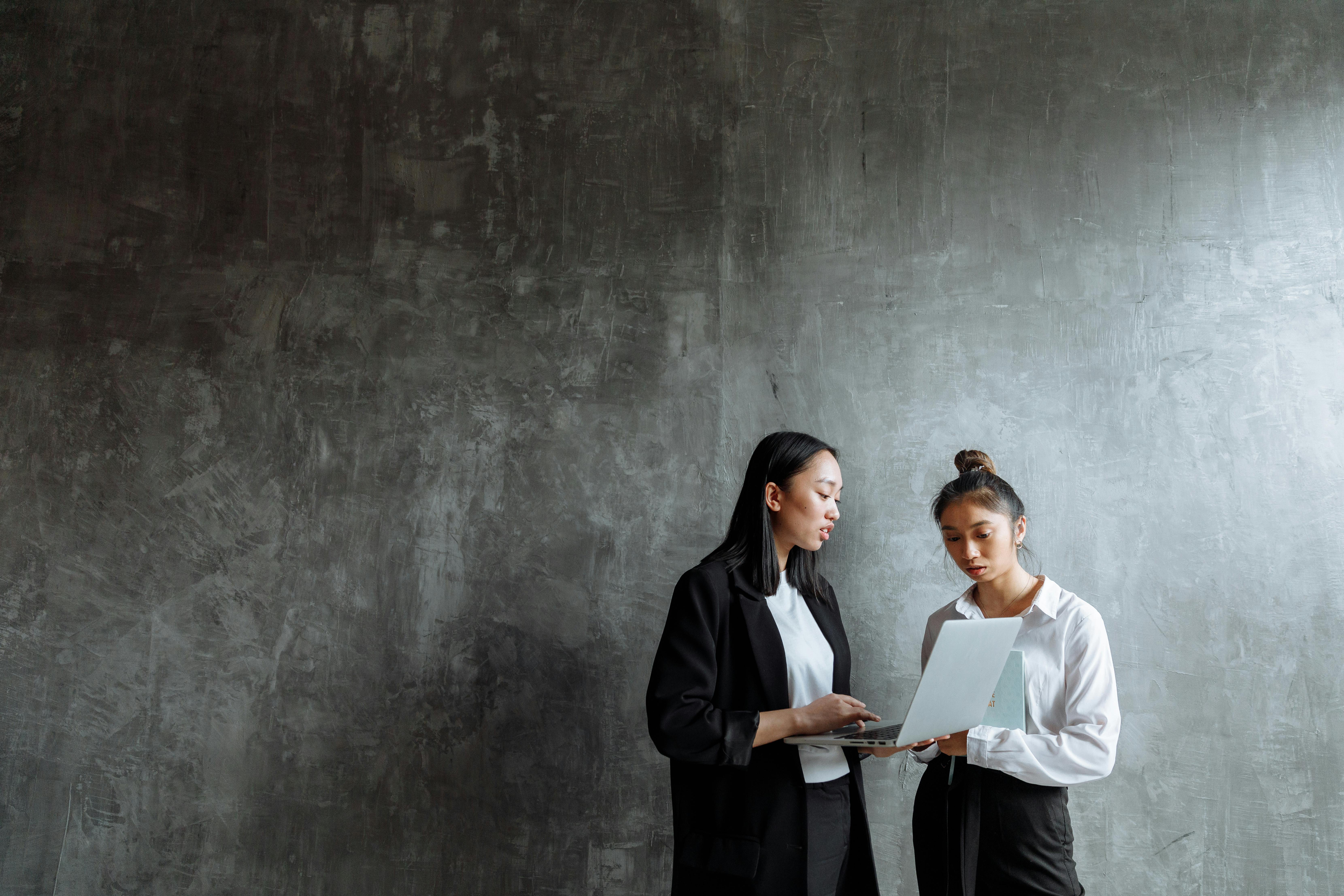 2 people with a grey background